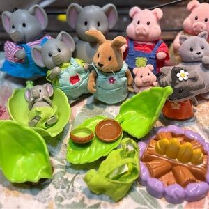 collection of Li'l Woodzeez miniature animal figurines elephant pig families